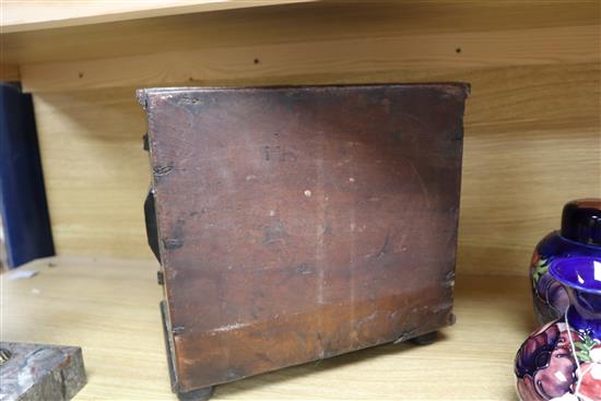 An inlaid oak spice cabinet, carved with the date, 1672 W.29cm